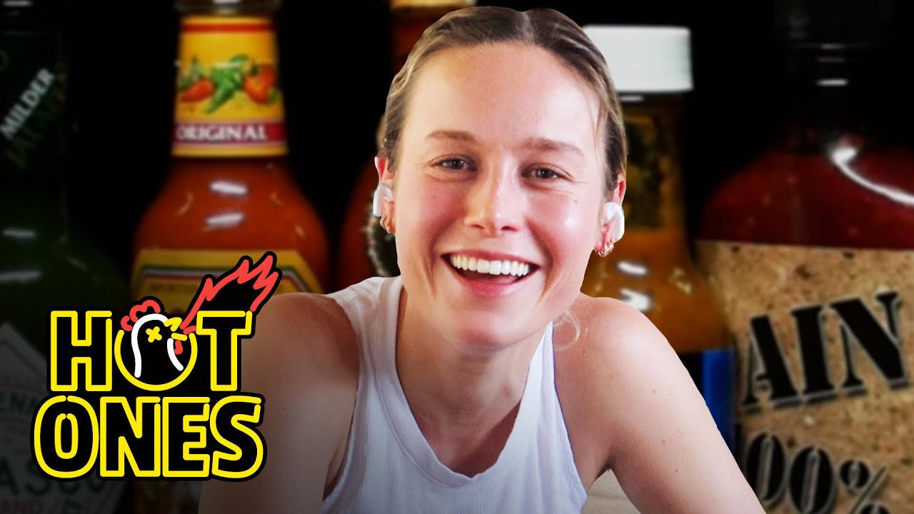 Brie Larson takes the ‘Hot Ones’ challenge from the comfort of her own home
